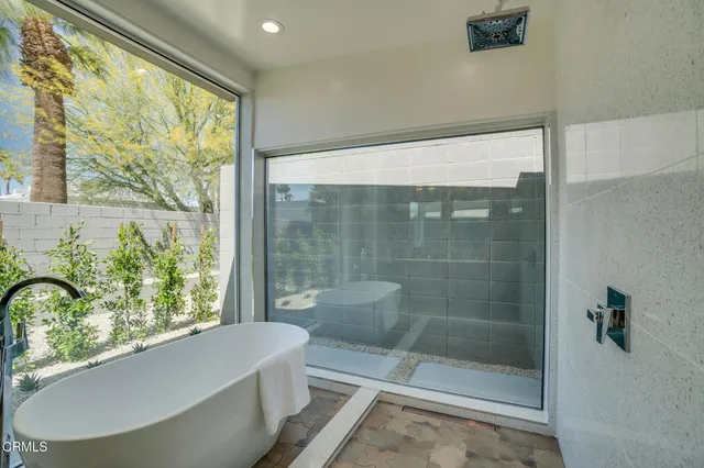 a backyard of a house with outdoor seating