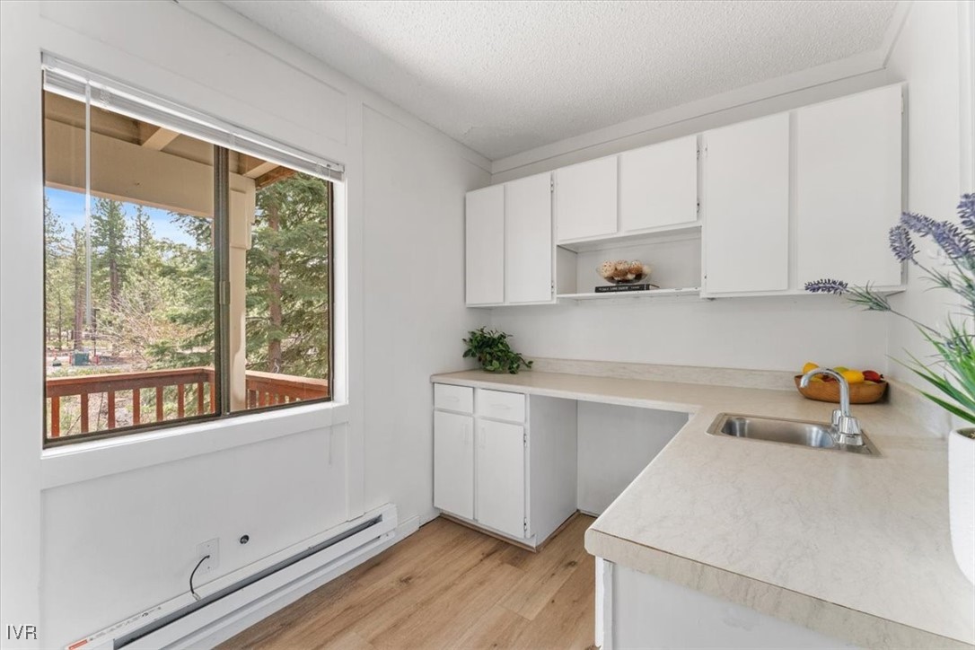 989 Tahoe Boulevard, Unit 20 Incline Village, NV 89451 - Photo 12 of 34 a kitchen with a sink a stove and cabinets