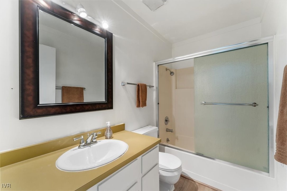 989 Tahoe Boulevard, Unit 20 Incline Village, NV 89451 - Photo 16 of 34 a bathroom with a sink a toilet and shower a mirror