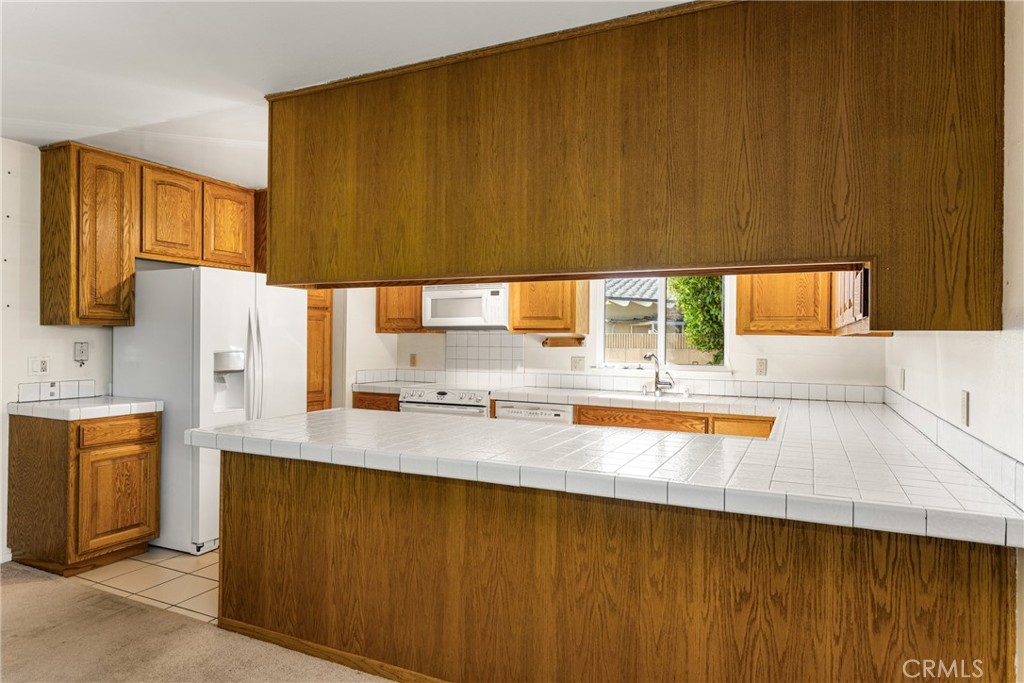 3288 Arizona Lane Costa Mesa, CA 92626 - Photo 11 of 33 a bathroom with a sink a mirror and a bathtub