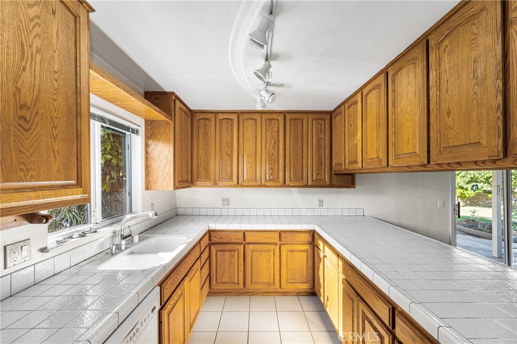 3288 Arizona Lane Costa Mesa, CA 92626 - Photo 15 of 33 a kitchen with a sink and a window