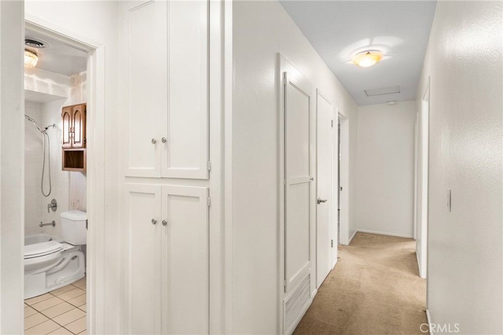 3288 Arizona Lane Costa Mesa, CA 92626 - Photo 20 of 33 a view of bathroom with a toilet sink and a mirror