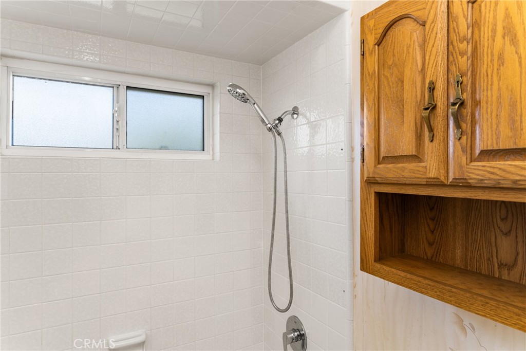 3288 Arizona Lane Costa Mesa, CA 92626 - Photo 22 of 33 a bathroom that has a glass shower door