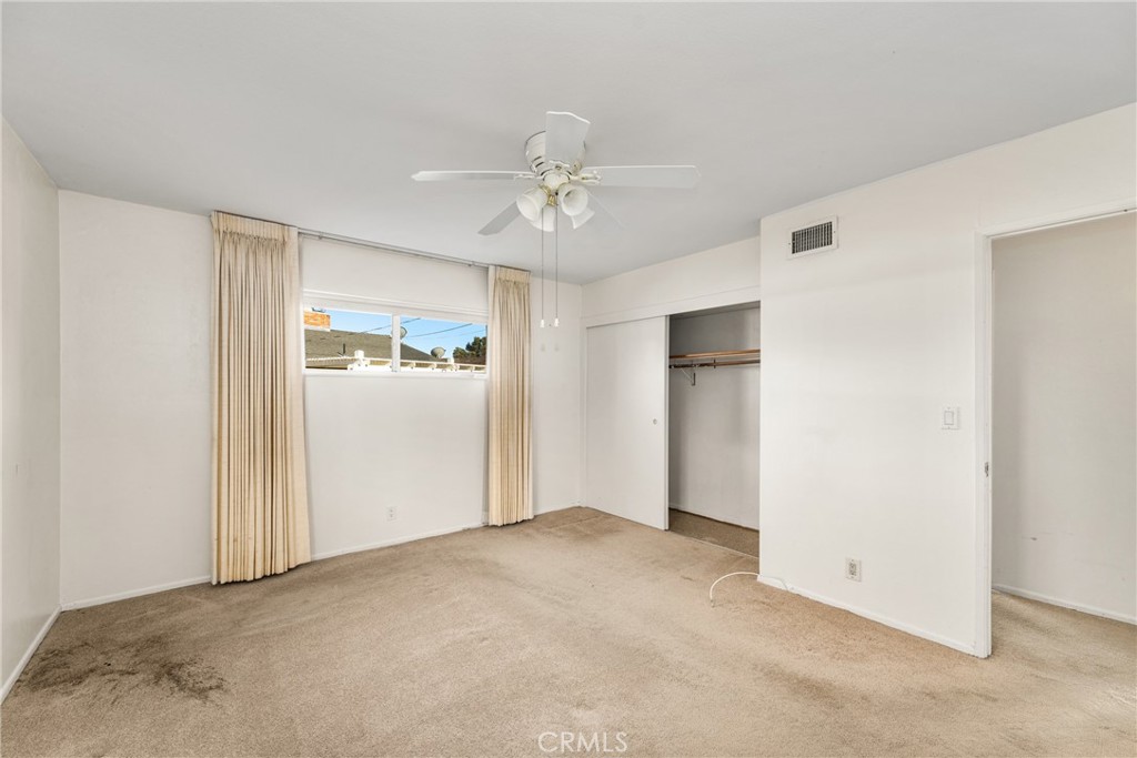 3288 Arizona Lane Costa Mesa, CA 92626 - Photo 28 of 33 an empty room with windows and cabinet