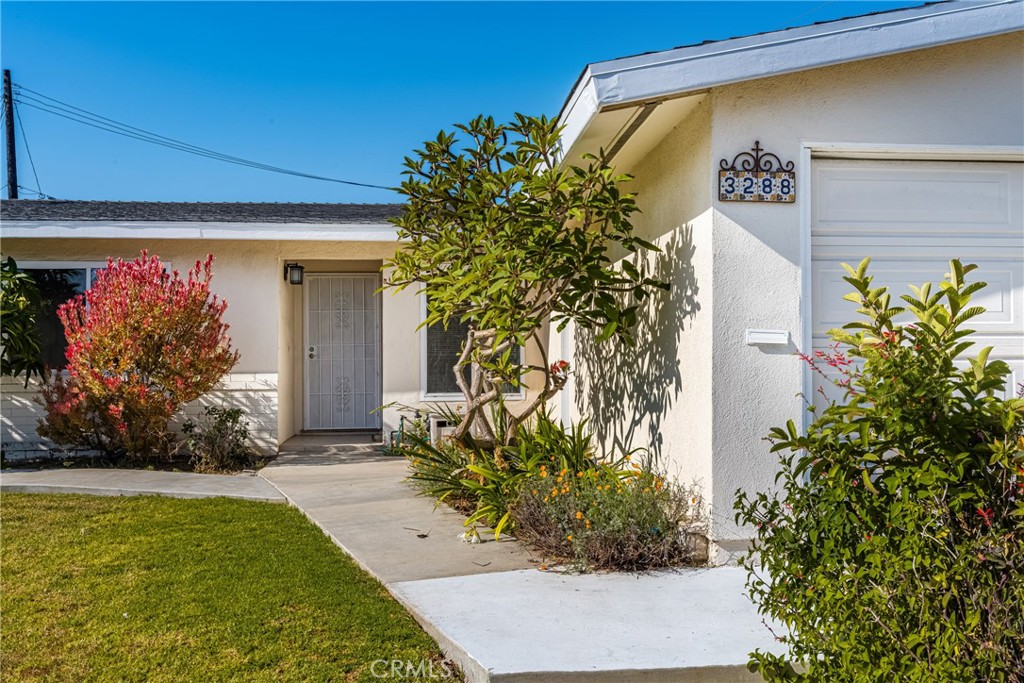 3288 Arizona Lane Costa Mesa, CA 92626 - Photo 4 of 33 a front view of a house with garden