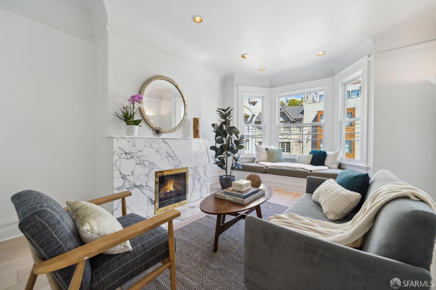 2421 Larkin Street San Francisco, CA 94109 - Photo 14 of 29 a living room with furniture a fireplace and a floor to ceiling window