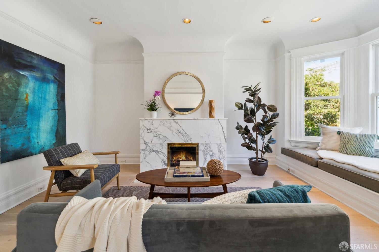 2421 Larkin Street San Francisco, CA 94109 - Photo 16 of 29 a living room with furniture and a fireplace