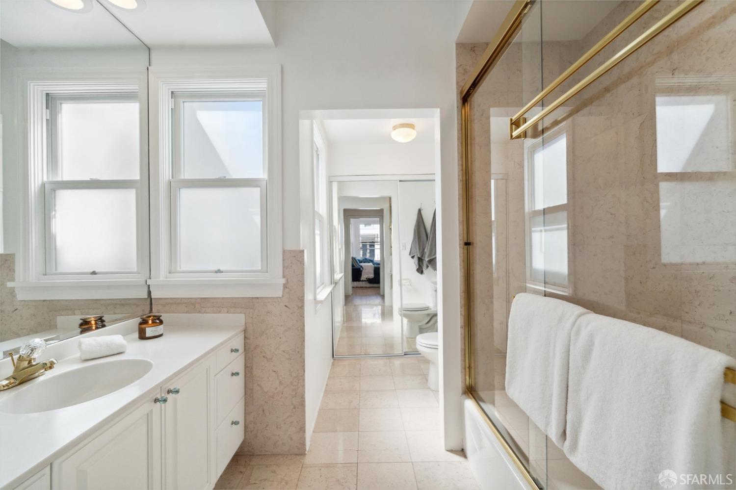 2421 Larkin Street San Francisco, CA 94109 - Photo 20 of 29 a bathroom with a sink and a mirror