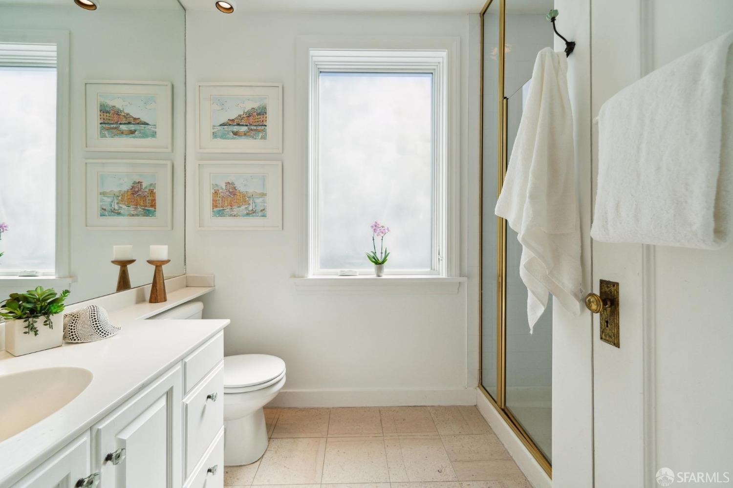 2421 Larkin Street San Francisco, CA 94109 - Photo 22 of 29 a bathroom with a sink toilet and shower