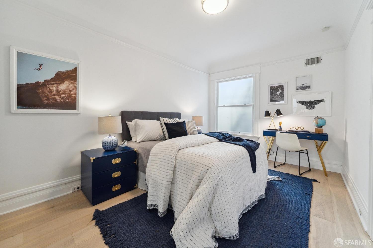 2421 Larkin Street San Francisco, CA 94109 - Photo 24 of 29 a bedroom with bed and a chair