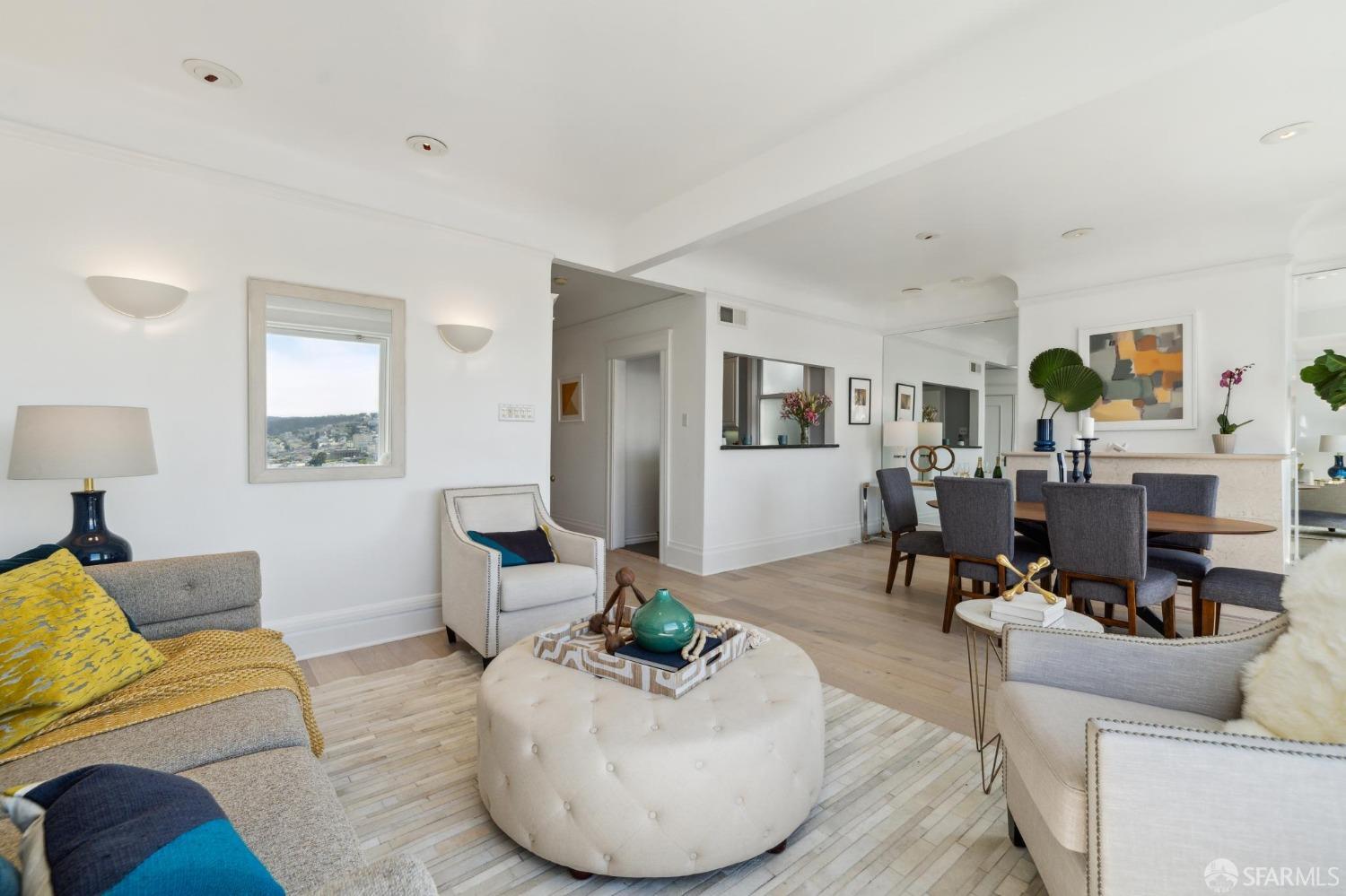 2421 Larkin Street San Francisco, CA 94109 - Photo 7 of 29 a living room with furniture and a fireplace