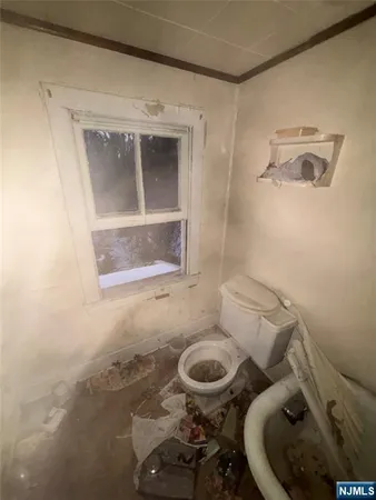 a bathroom with a toilet and a sink