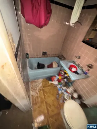 a bathroom with a sink and toilet
