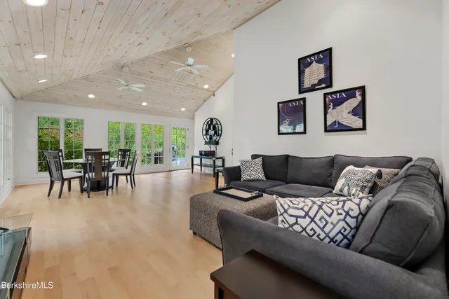 a view of a hallway with paintings on the wall