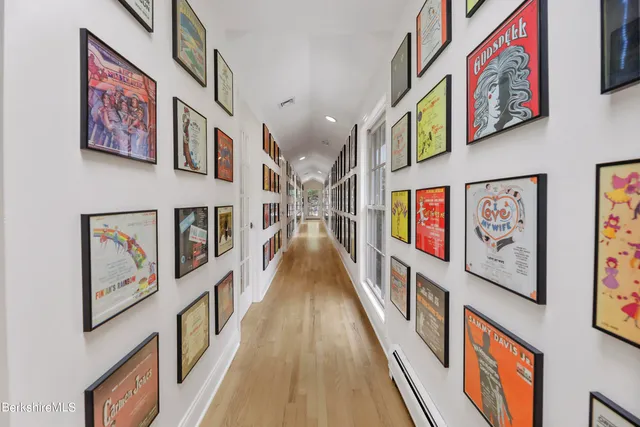 a view of a bedroom with furniture and windows
