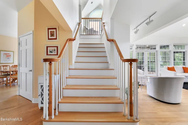 a bedroom with a large bed and a large window