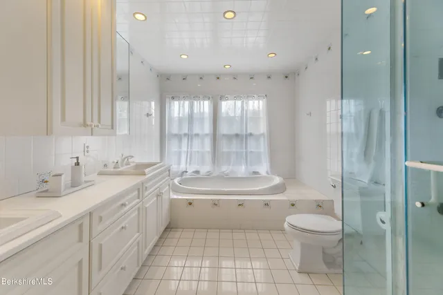 a bathroom with a shower and a sink