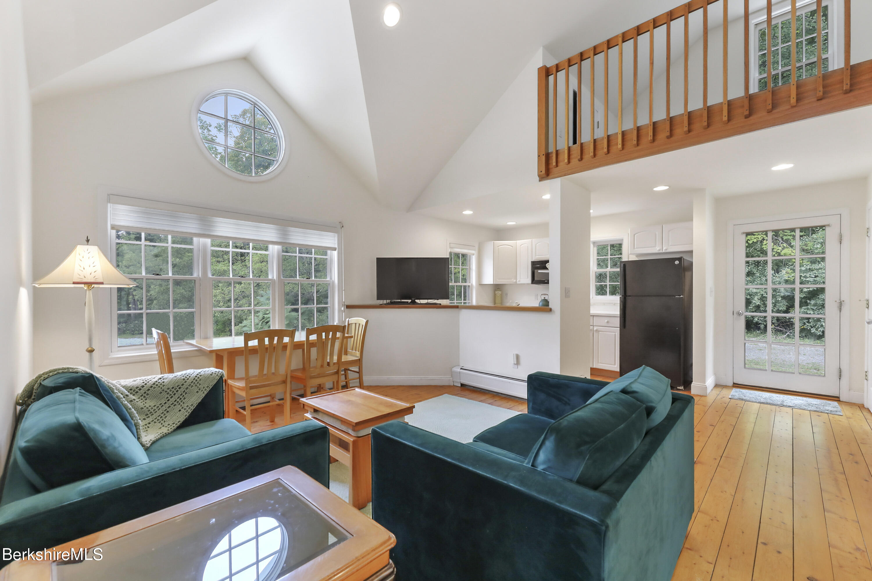 248 E Road Alford, MA 01266 - Photo 31 of 43 a living room with furniture and a floor to ceiling window
