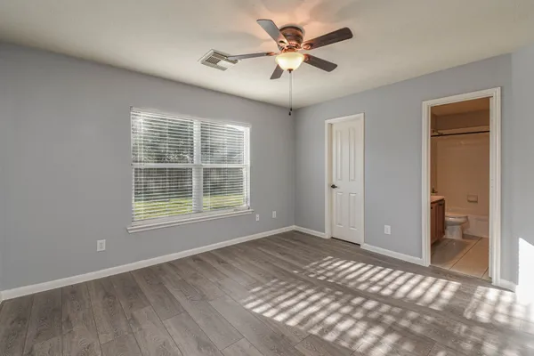 a view of an empty room with a window