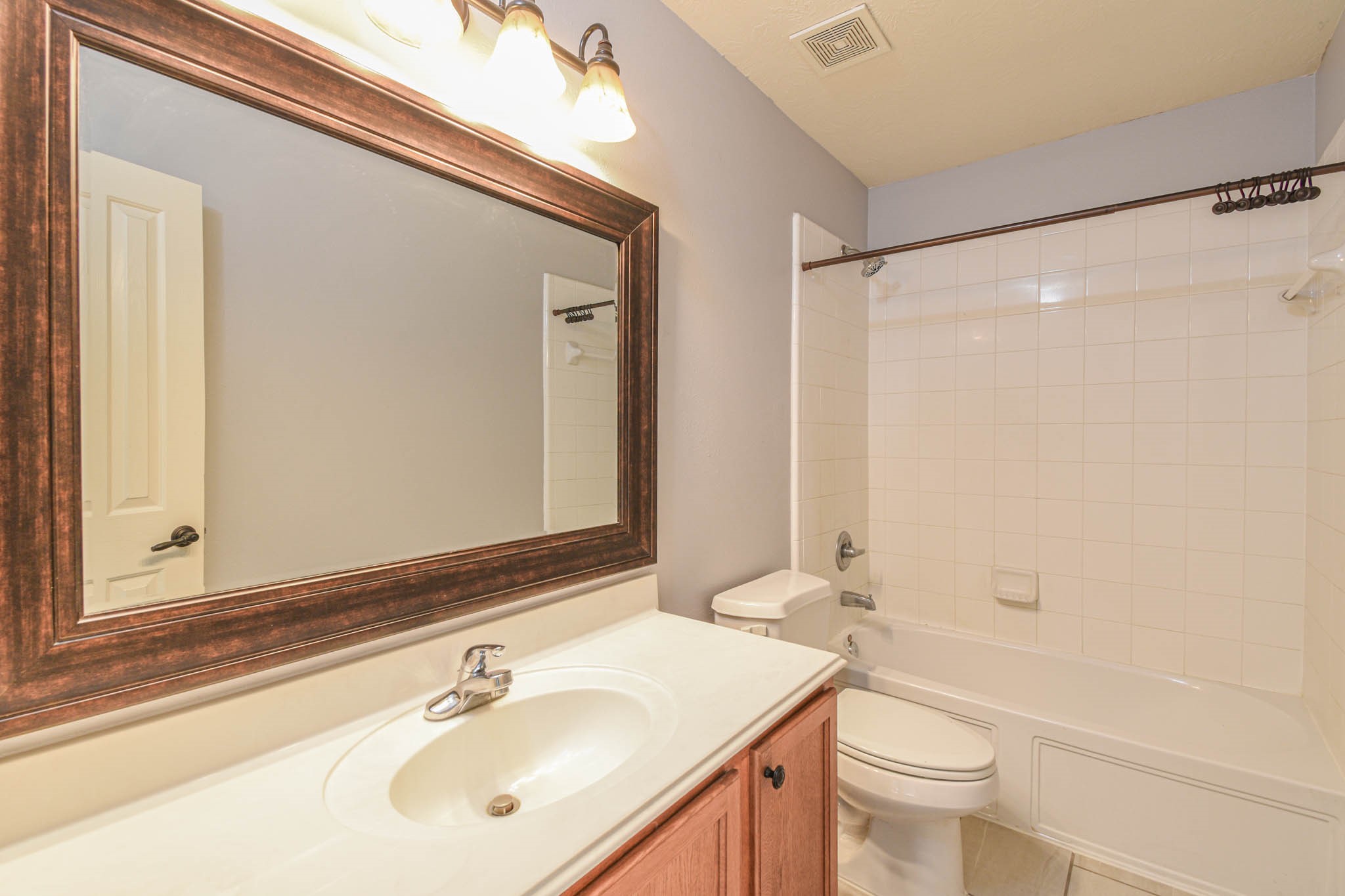 8203 Nagy Hill Street Spring, TX 77379 - Photo 13 of 21 a bathroom with a sink toilet and shower