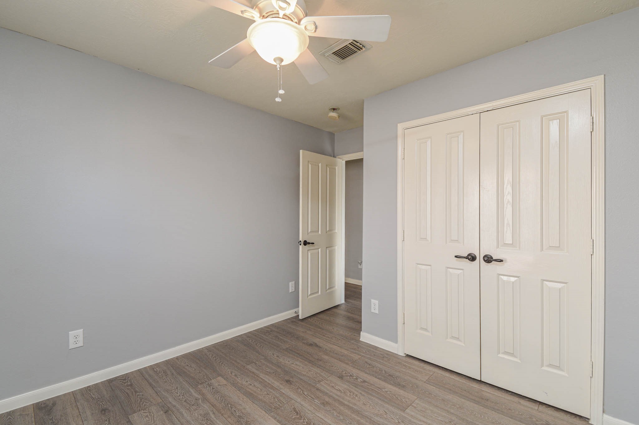 8203 Nagy Hill Street Spring, TX 77379 - Photo 14 of 21 a view of an empty room with wooden floor