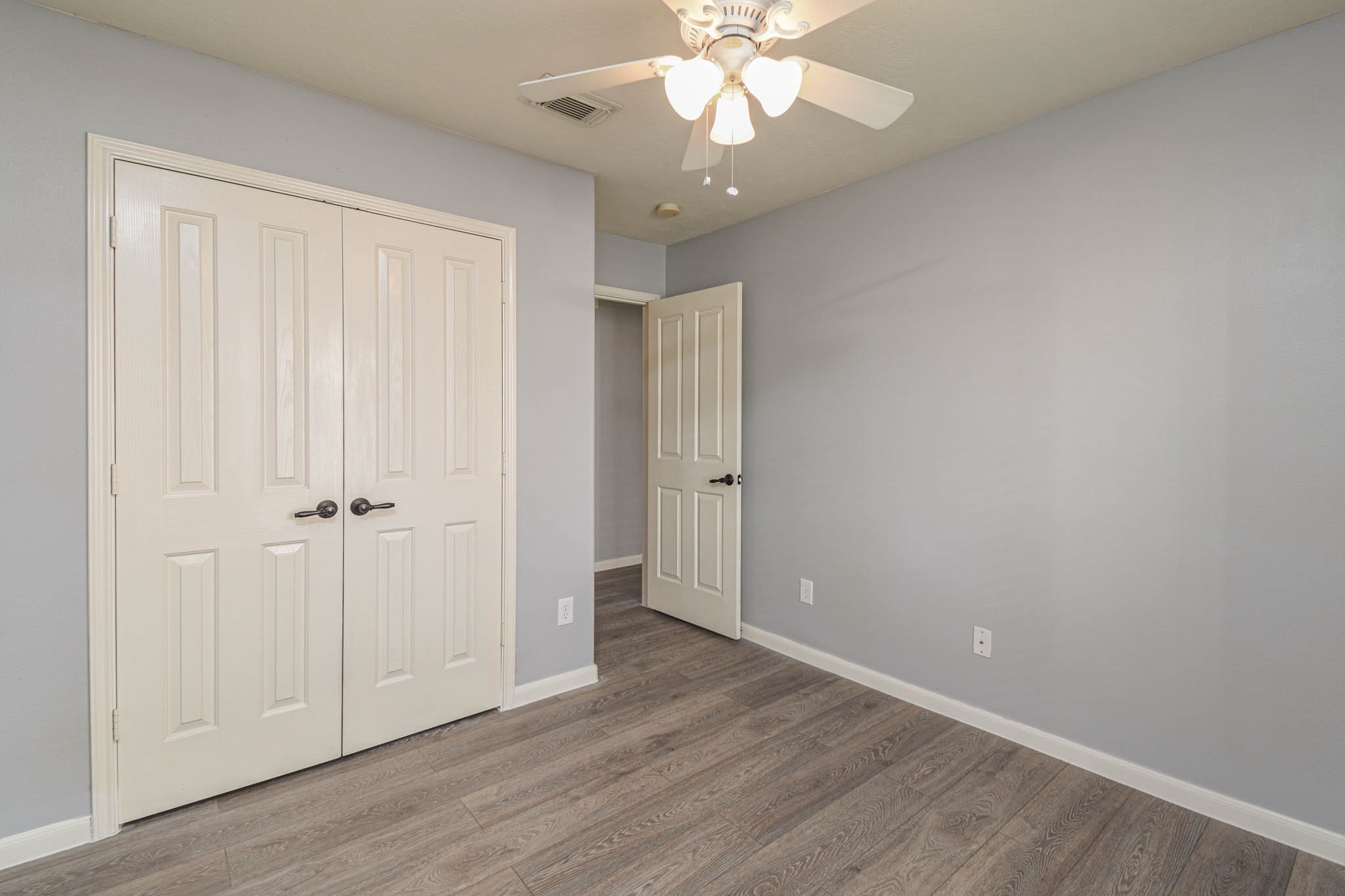 8203 Nagy Hill Street Spring, TX 77379 - Photo 16 of 21 a view of an empty room with wooden floor