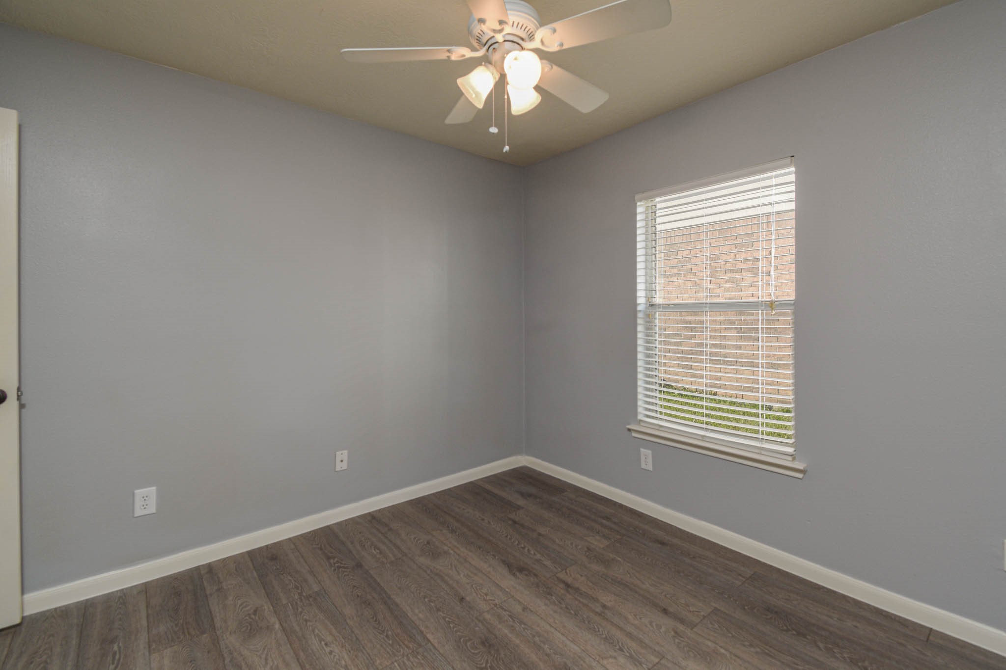 8203 Nagy Hill Street Spring, TX 77379 - Photo 17 of 21 wooden floor in an empty room with a window