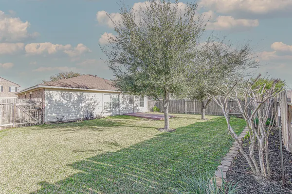 a view of a backyard with a garden