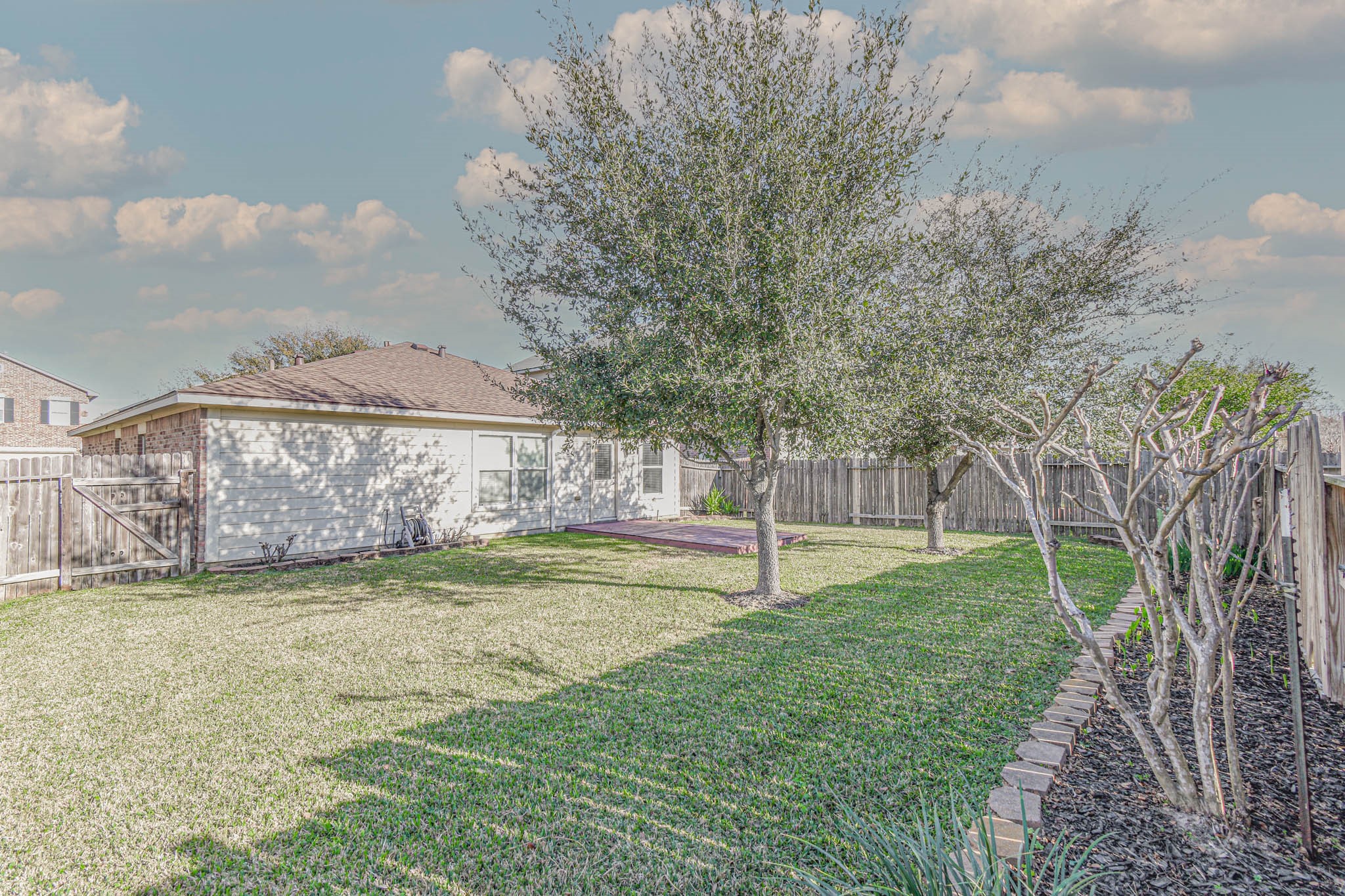 8203 Nagy Hill Street Spring, TX 77379 - Photo 20 of 21 a view of a backyard with a garden