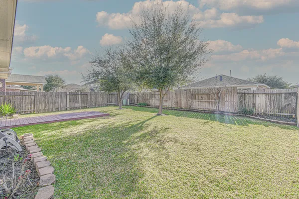 a view of a swimming pool with a yard