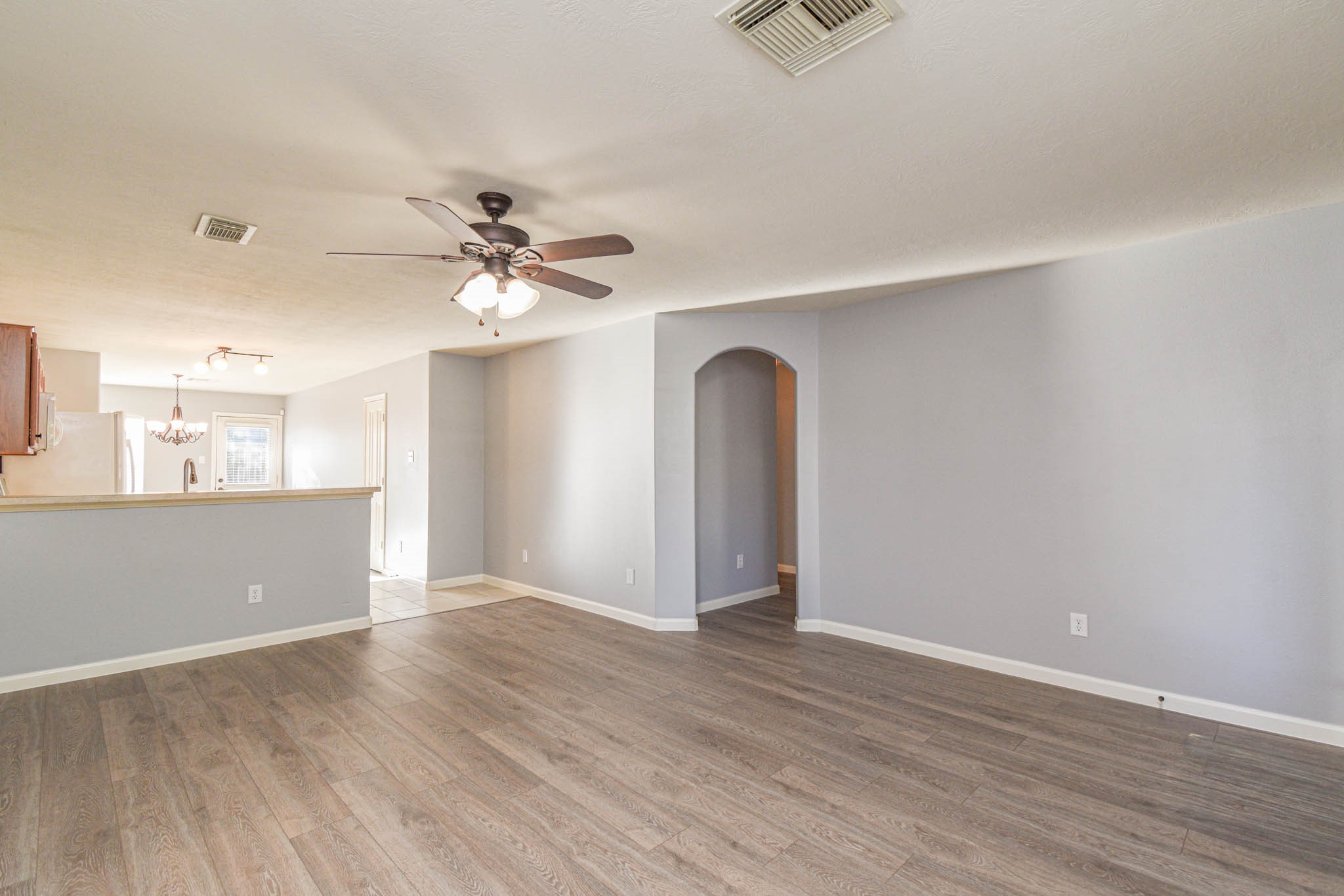 8203 Nagy Hill Street Spring, TX 77379 - Photo 5 of 21 wooden floor in an empty room with a window