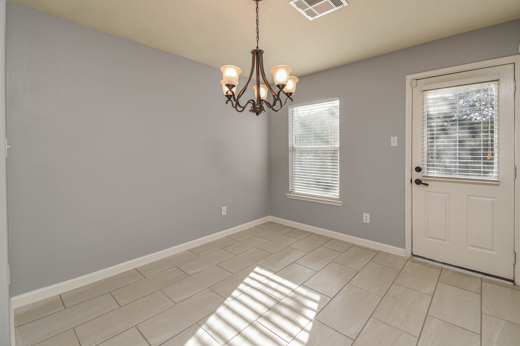 8203 Nagy Hill Street Spring, TX 77379 - Photo 7 of 21 a view of an empty room with a window
