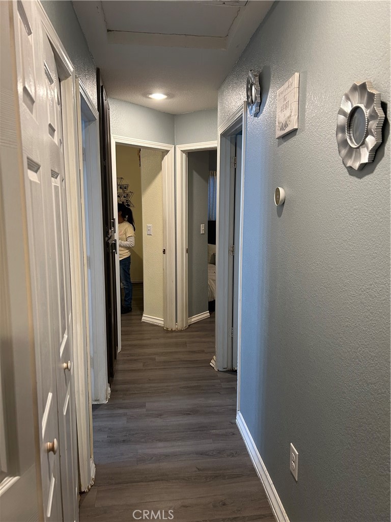 515 Monique Street Merced, CA 95341 - Photo 11 of 22 a view of a hallway with wooden floor