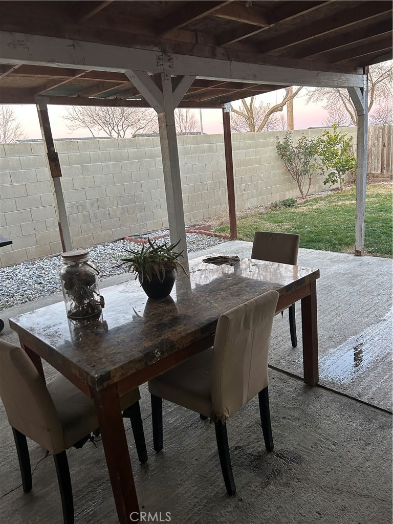 515 Monique Street Merced, CA 95341 - Photo 16 of 22 a view of a dining room with furniture and wooden floor