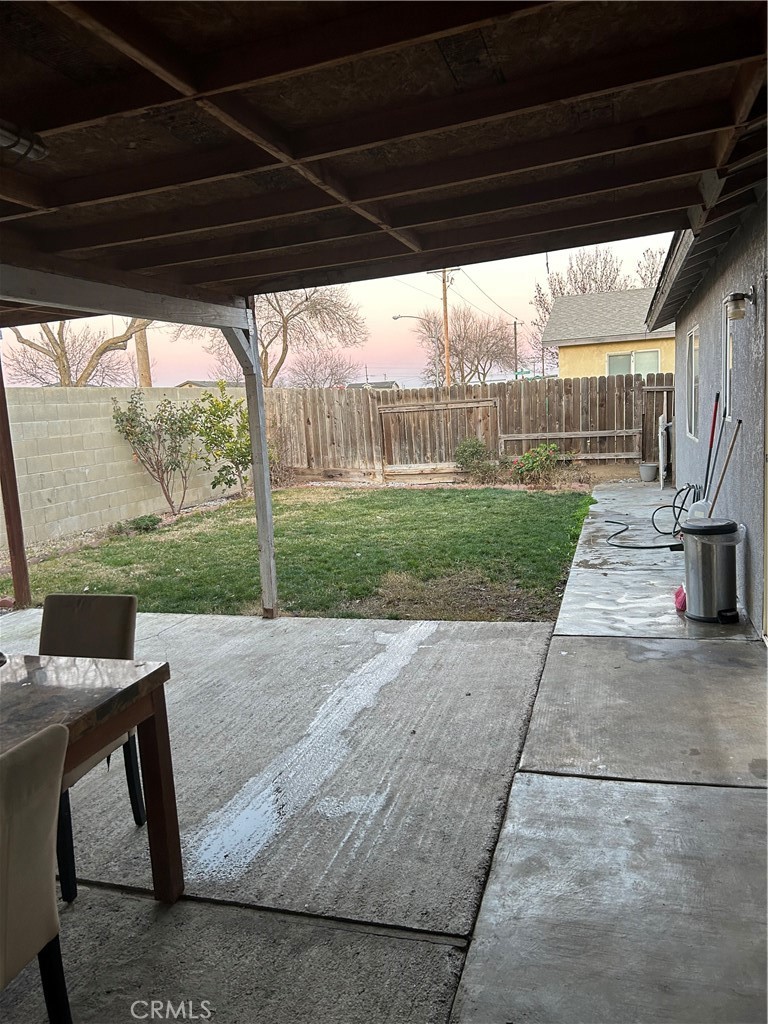 515 Monique Street Merced, CA 95341 - Photo 17 of 22 a view of a porch with furniture and a yard