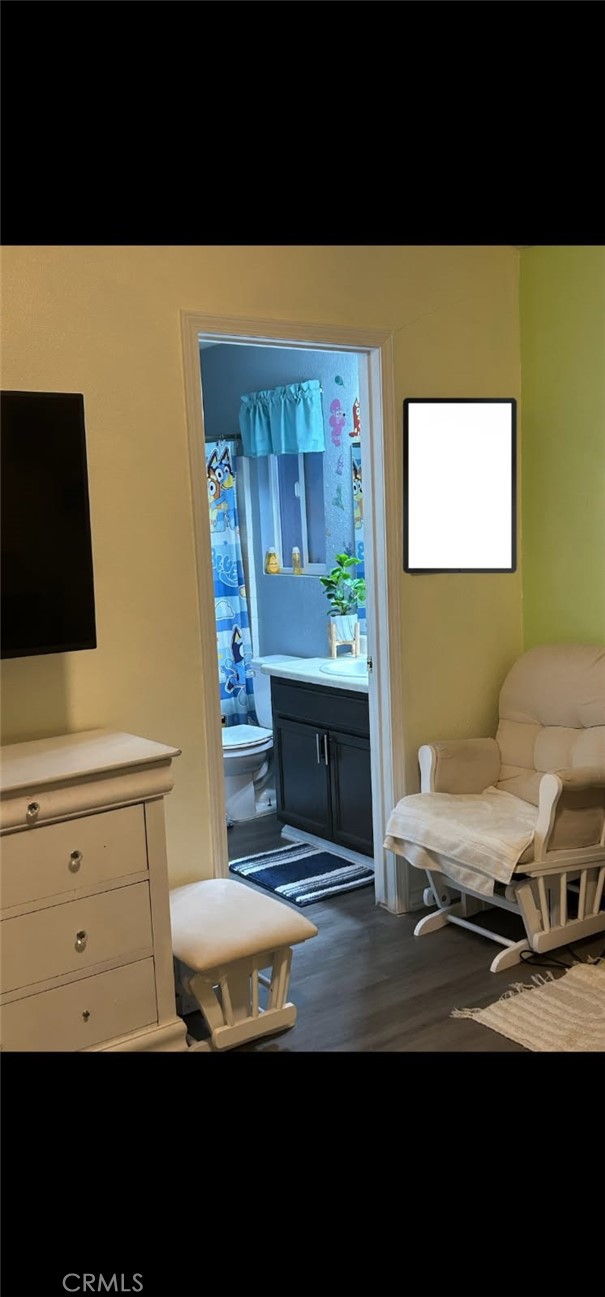 515 Monique Street Merced, CA 95341 - Photo 19 of 22 a living room with furniture and a flat screen tv