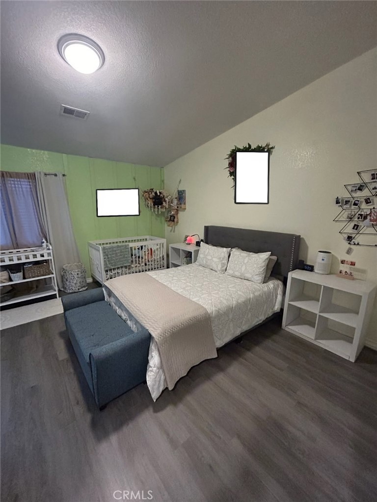 515 Monique Street Merced, CA 95341 - Photo 21 of 22 a bedroom with a bed and a couch