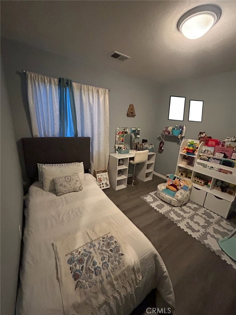 515 Monique Street Merced, CA 95341 - Photo 22 of 22 a bedroom with a bed and window