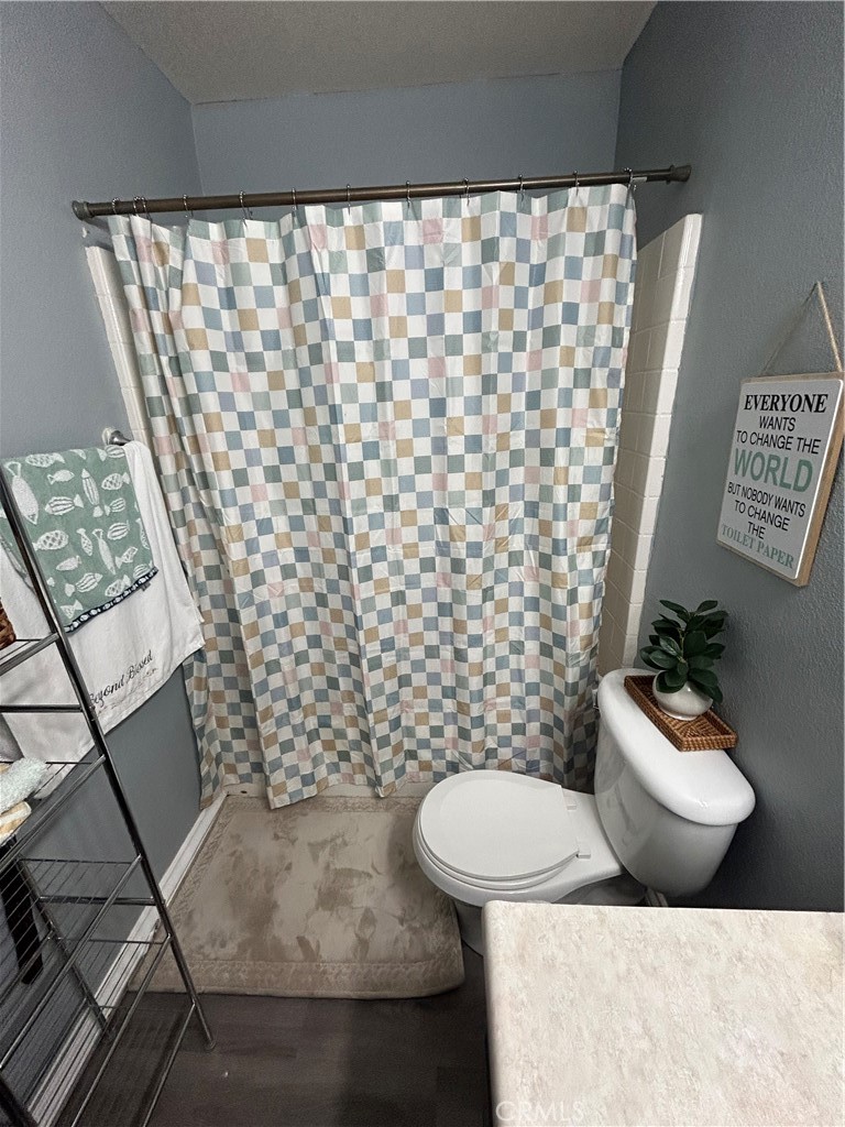 515 Monique Street Merced, CA 95341 - Photo 7 of 22 a bathroom with a sink toilet and shower