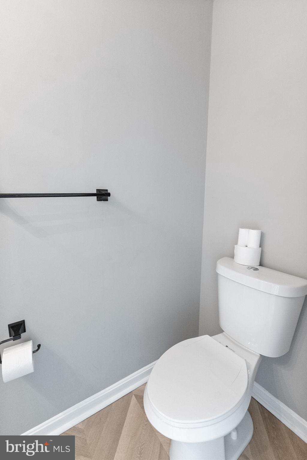1527 Lincoln Road Shady Side, MD 20764 - Photo 10 of 30 a white toilet sitting next to a bathroom sink