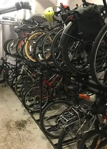 a close up of a bike parked in a lot of water heater