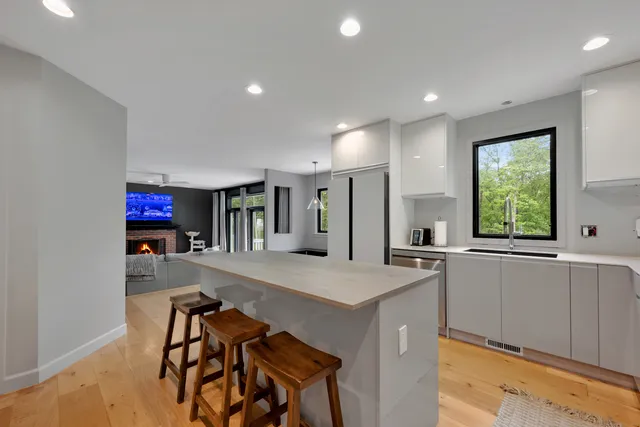 a kitchen with stainless steel appliances a refrigerator and a stove
