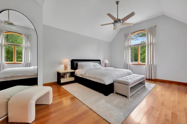 a white tub sitting next to a window