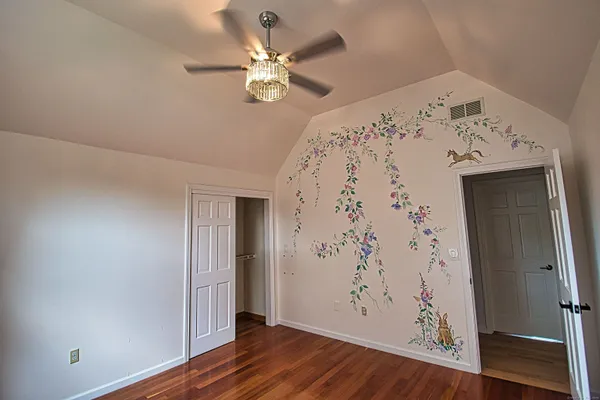 a view of a livingroom with furniture and a flat screen tv