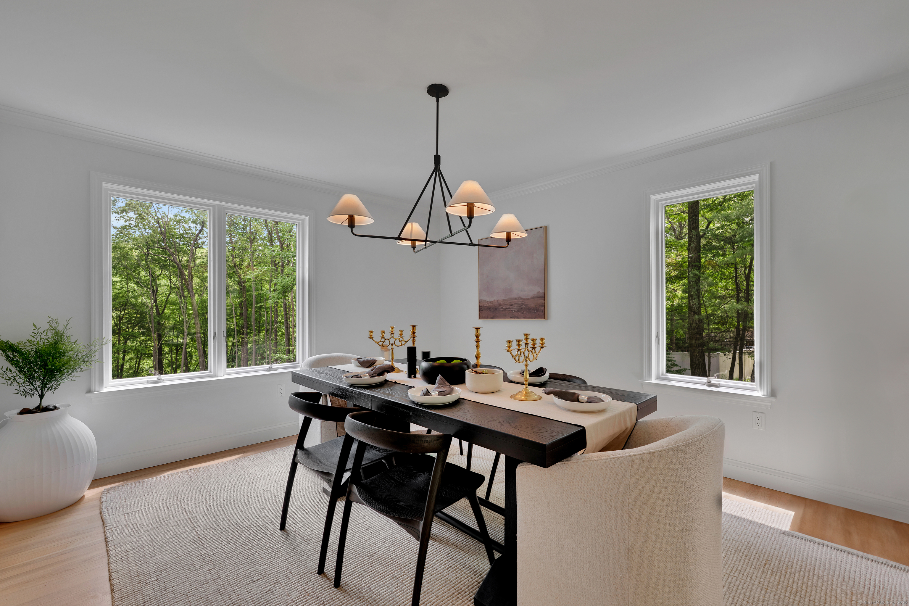 60 Wildcat Road Burlington, CT 06013 - Photo 10 of 39 a dining room with furniture a chandelier and wooden floor