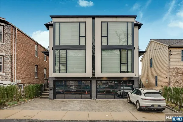 front view of a house with a cars