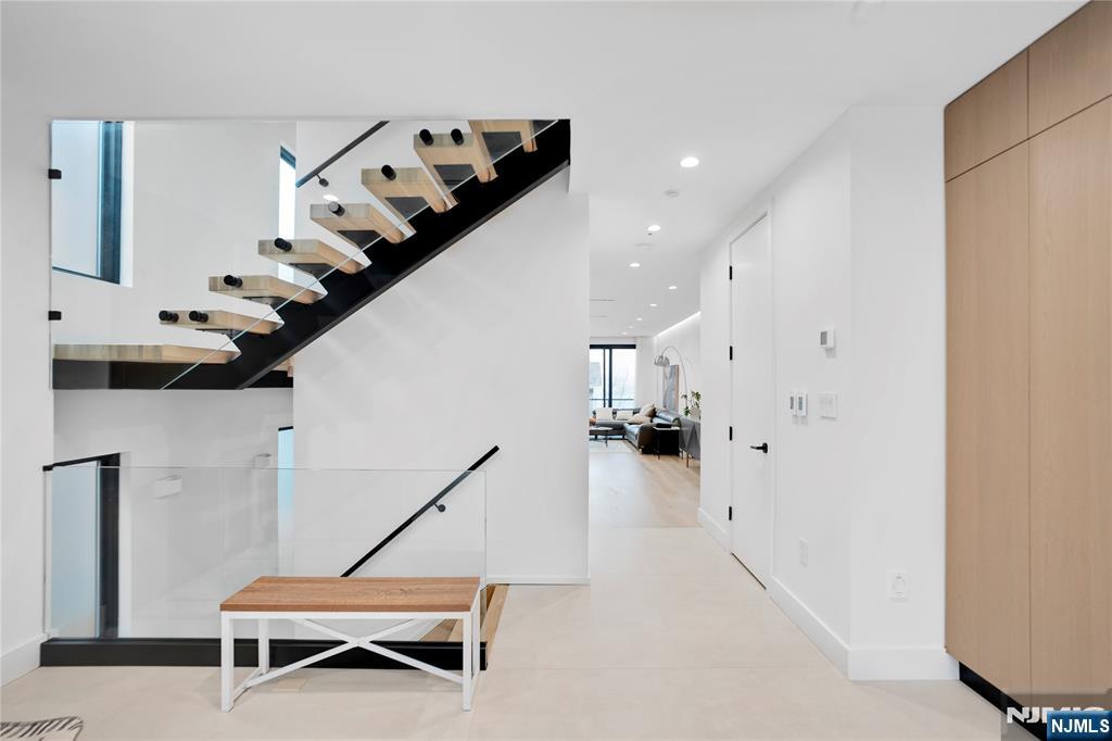 7 Adelaide Place Edgewater, NJ 07020 - Photo 5 of 24 a view of a livingroom with furniture and stairs