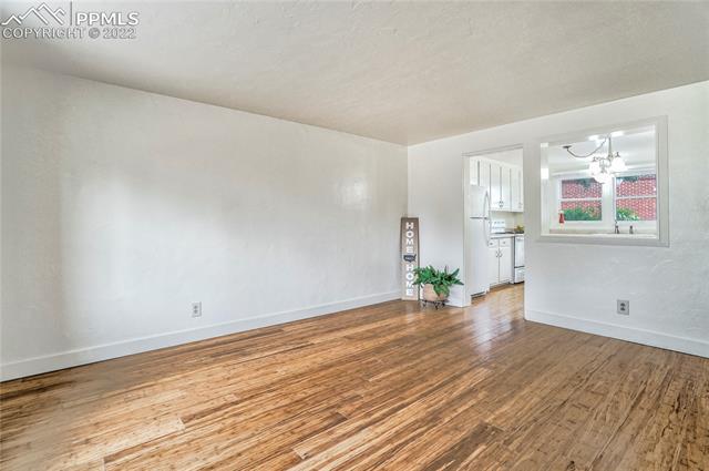 2455 Paseo Road Colorado Springs, CO 80907 - Photo 3 of 32 Great Room. Bamboo flooring thru out the main level.
