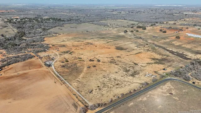 a view of a dry yard with wooden floor