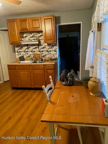 a room with wooden floor and furniture